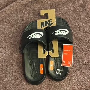 Nike slides.